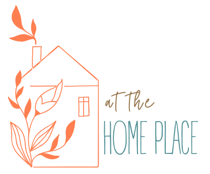 House with flowers next to the words at the homeplace